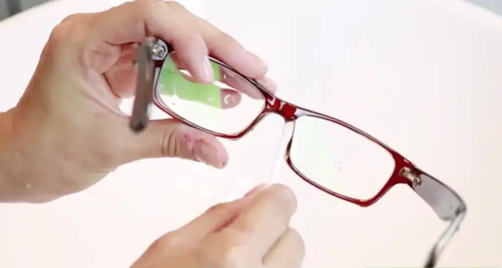 Cleaning glasses with a cotton swab