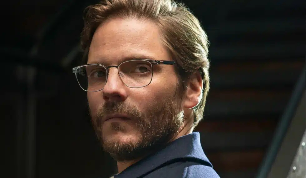 Daniel Brühl as the ambassador of ic! berlin wearing rectangular eyeglasses