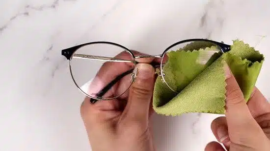 Drying eyeglasses with a soft microfiber cloth