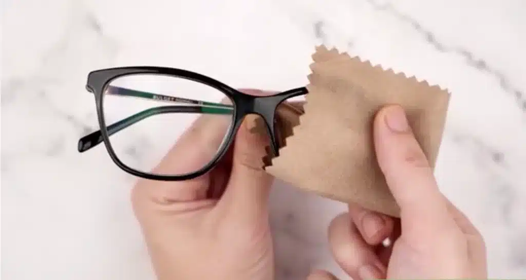 Wiping lenses to make them clean and clear