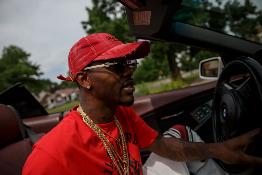 The General, who refers to himself as the “Cartier King,” wears white Cartier buffs