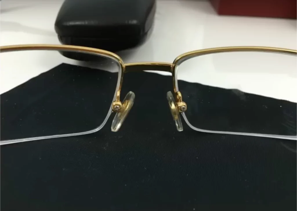 A fake pair of Cartier eyeglasses: nose bridge doesn't contain a serial number