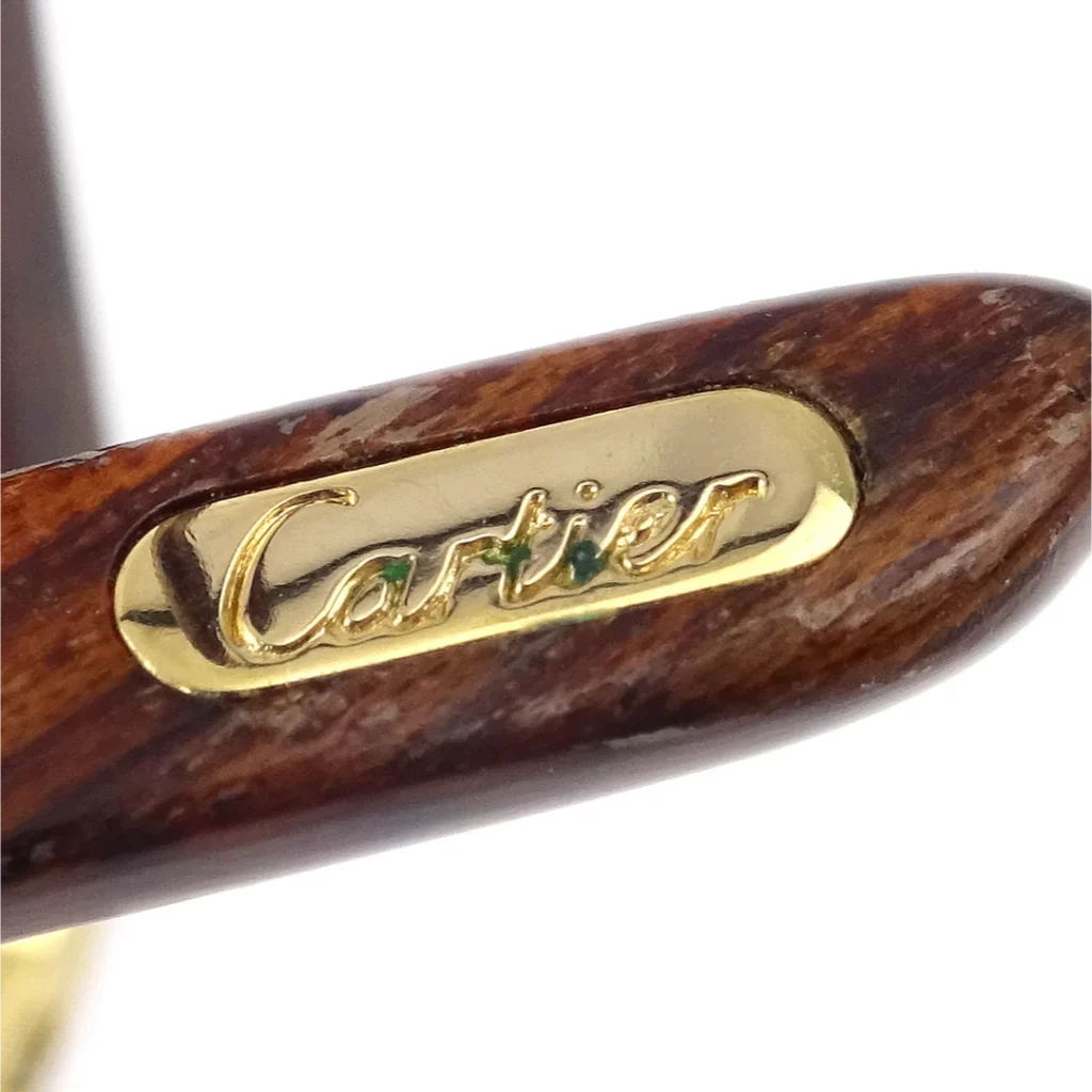 Logo plate of Cartier real glasses: a close view