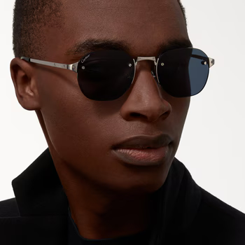 Stylish Santos de Cartier shades on model