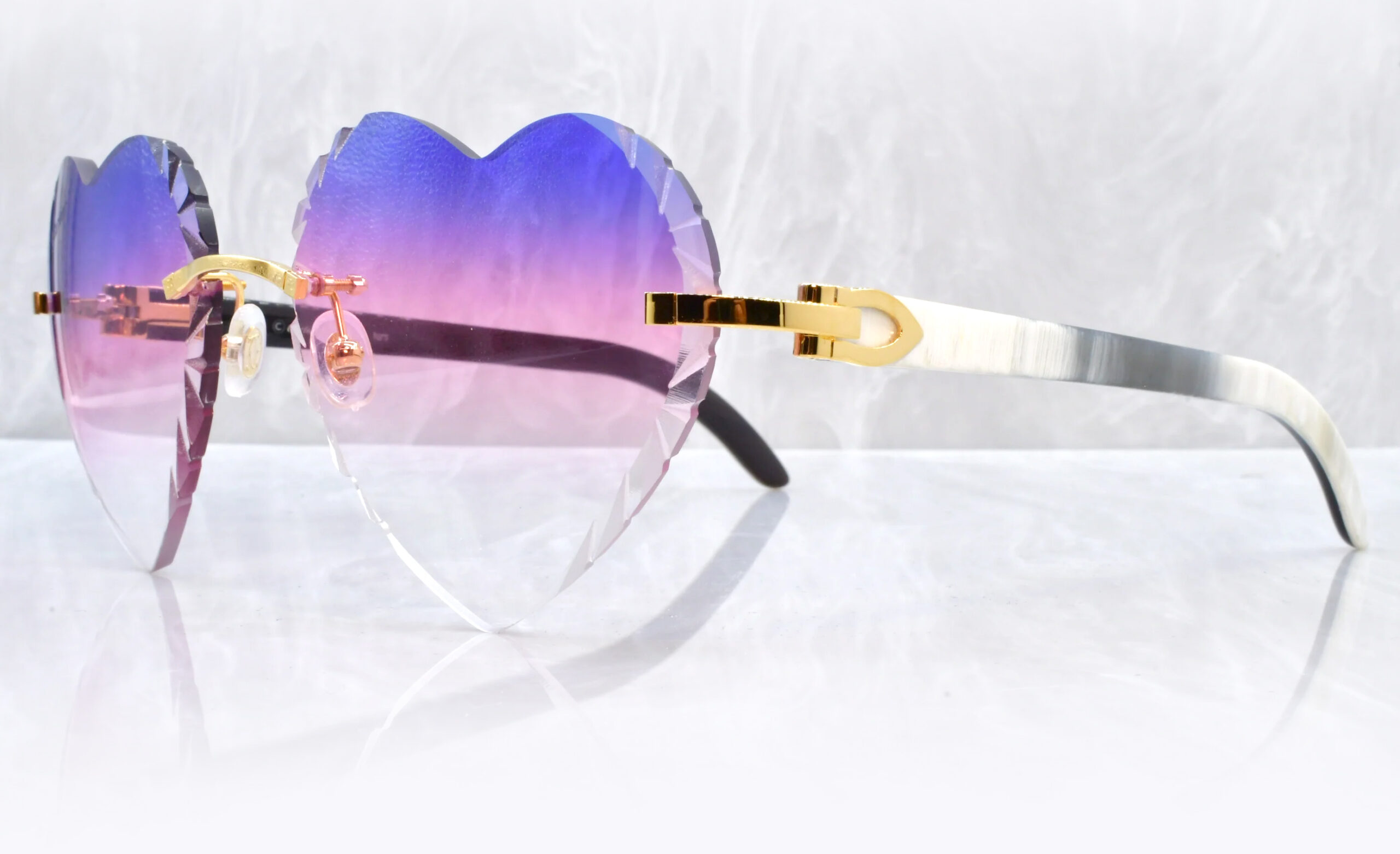 Cartier white buffs with heart-shaped gradient lenses