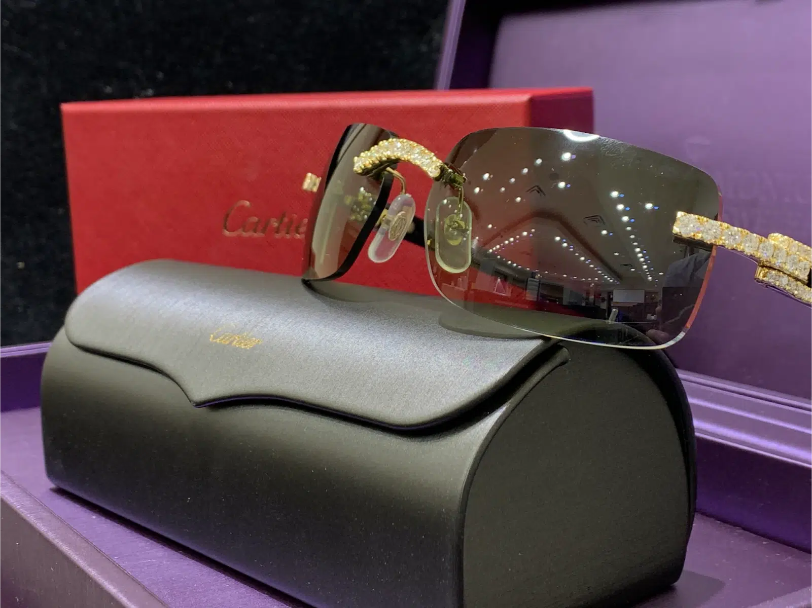 Cartier black horn diamond glasses with a protective case